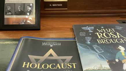Holocaust remembrance materials on Asm. Muratsuchi's desk on the Assembly Floor