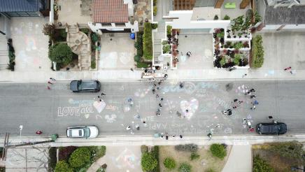 Overhead view of chalk writing on street