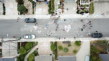 Overhead view of chalk writing on street