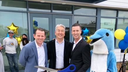 Asm. Muratsuchi with officials, mascot and large scissors