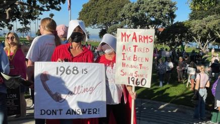 Marchers holding signs