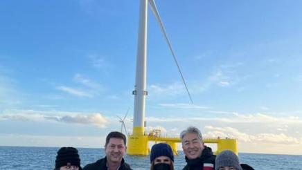 Asm. Muratsuchi and other legislators with windmill in background
