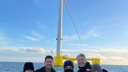 Asm. Muratsuchi and other legislators with windmill in background