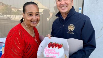 Asm. Muratsuchi with Wanda, holding cake