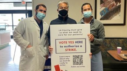 Asm. Muratsuchi holding strike sign with physicians