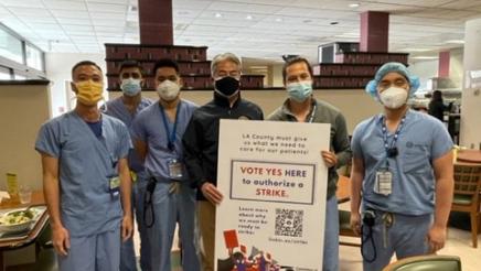 Asm. Muratsuchi holding strike sign with physicians