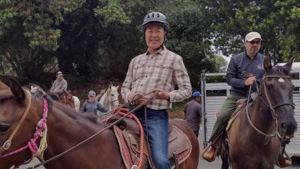 Asm. Muratsuchi and participant mounted on horses