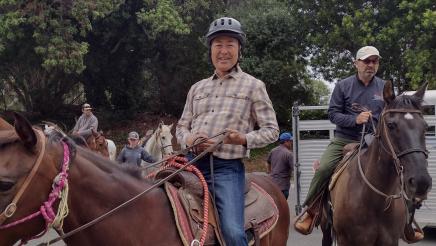 Asm. Muratsuchi and participant mounted on horses