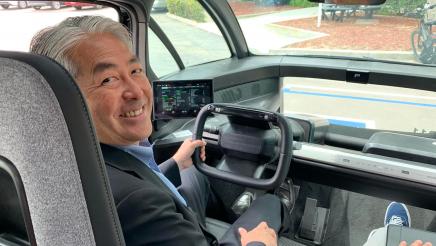 Asm. Muratsuchi behind the wheel of Canoo vehicle