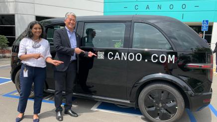 Asm. Muratsuchi with tour guide viewing a Canoo vehicle