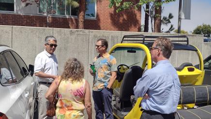 Asm. Muratsuchi speaking with city officials in parking lot
