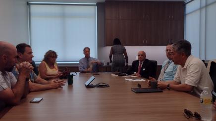 Asm. Muratsuchi and city officials in discussion around table