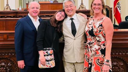 Assemblymember Muratsuchi poses for a group photo in front of the Assembly chambers with the McNally family. 