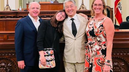 Assemblymember Muratsuchi poses for a group photo in front of the Assembly chambers with the McNally family. 