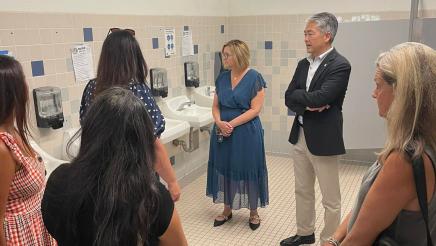 Asm. Muratsuchi and school staff inspecting restroom sinks