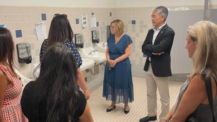 Asm. Muratsuchi and school staff inspecting restroom sinks