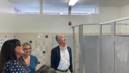 Asm. Muratsuchi and school staff inspecting restroom ceiling