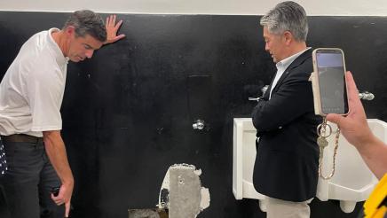 Asm. Muratsuchi and school staff inspecting restroom flooring