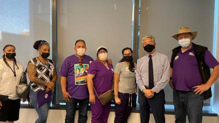Assemblymember Muratsuchi poses for a group photo with a group of labor union leaders, advocates, and activists. 