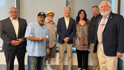 Assemblymember Muratsuchi poses for a group photo with a group of labor union leaders, advocates, and activists. 