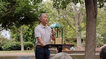 Assemblymember Al Muratsuchi speaks on stage to attendees of the Community Coffee in Rancho Palos Verdes. 