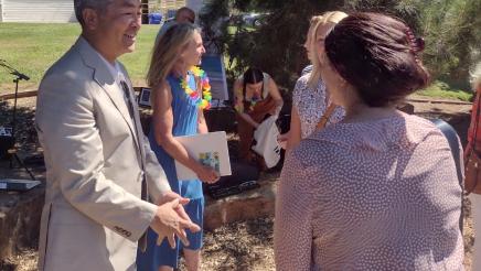 Assemblymember Al Muratsuchi speaks with a constituent at the International Day of Peace event. 