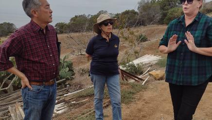 Asm. Muratsuchi listens on as guide speaks