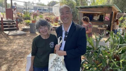 Asm. Muratsuchi with staffer, holding bag