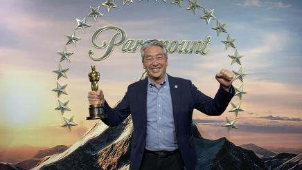 Asm. Muratsuchi with oscar in hand with Paramount logo in background