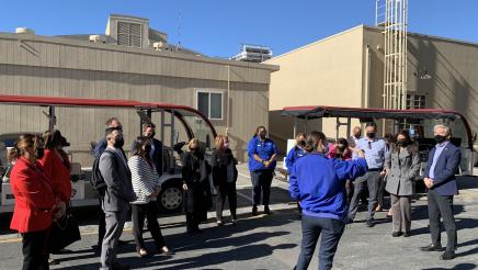 Asm. Muratsuchi and other tour participants listening to guide speaking
