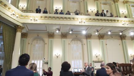 Assemblymembers applauding Japanese-American honorees