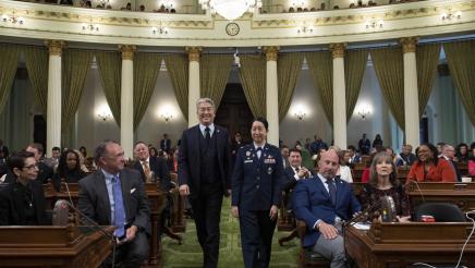 Asm. Muratsuchi escorting Colonel Mia L. Walsh on the Assembly Floor