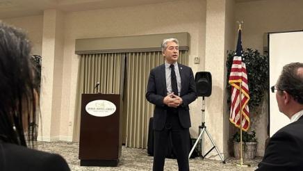 Asm. Muratsuchi standing, speaking to attendees