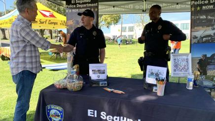 Asm. Muratsuchi greeting officers at the El Segundo Police Department booth