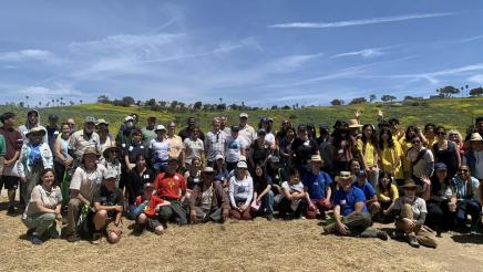 Group photo in outdoor setting, including Asm. Muratsuchi at center