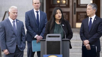 Isabel Aguayo at podium, speaking