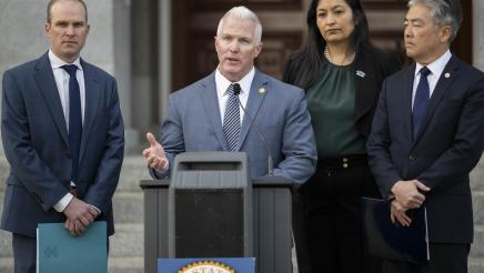 Jeff W. Reisig at podium, speaking