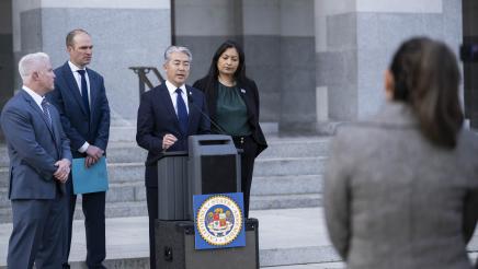 Asm. Muratsuchi at podium, speaking to press