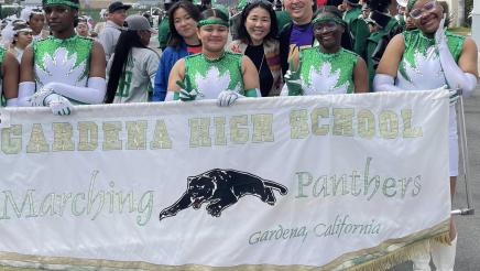 Asm. Muratsuchi with Gardena High School Marching Panthers members holding banner