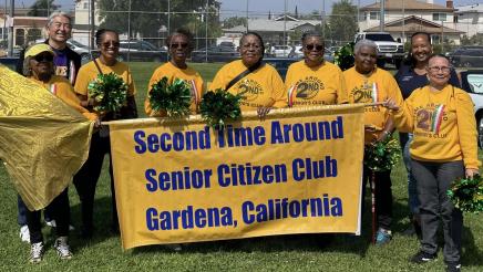 Asm. Muratsuchi with Second Time Around senior citizens club members holding banner