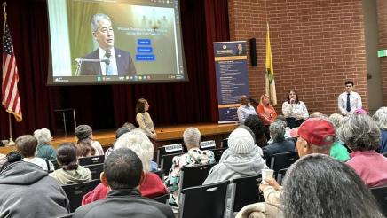 Senior Scam Stopper attendees, with Asm. Muratsuchi's website displayed on large screen