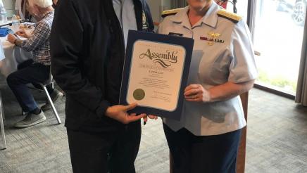 Asm. Muratsuchi presenting Rear Admiral Carola List with an award