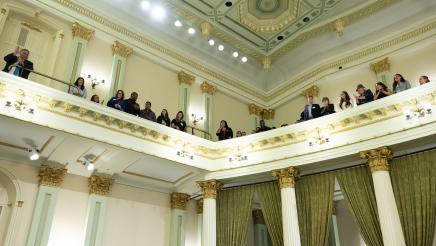 Members of Leadership Torrance lined up around the Assembly Floor's balcony