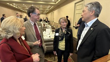 Asm. Muratsuchi conversing with league members