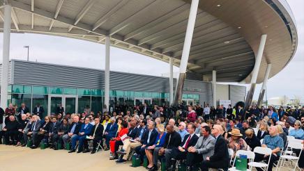Many seated attendees listening on