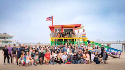 Group photo of Asm. Muratsuchi and celebrants on and in front of the Hermosa Beach Pride Lifeguard Tower