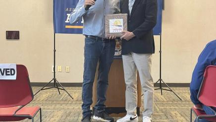 Asm. Muratsuchi with guest speaker, displaying Redondo Beach plaque