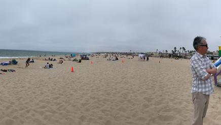 Wide view of beach, featuring Asm. Muratsuchi speaking with two constituents