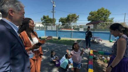 Principal Swearinger speaks as Asm. Muratsuchi and Tanya Ortiz Franklin observe students