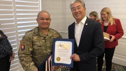 Asm. Muratsuchi presenting resolution to TSgt. Robert D. Spear